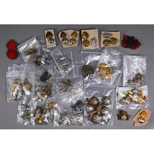 1117 - A large quantity of mostly British military cap badges, late 19th century and later, some duplicates... 