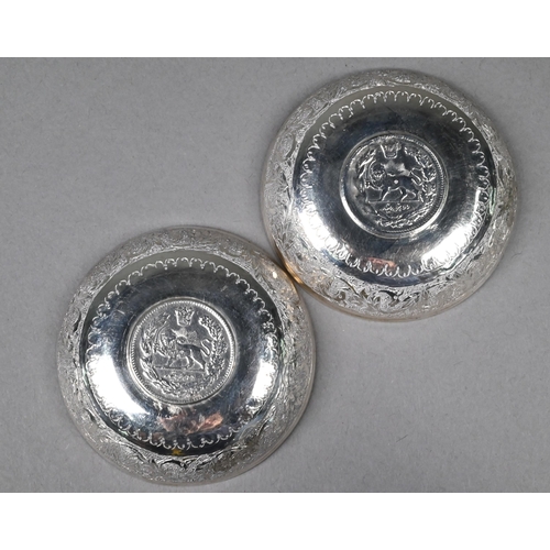 118 - Pair of Persian silver dishes inset with coins, 7 cm diam, to/w a low-grade white metal beaker (3)