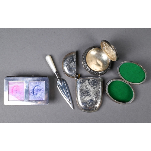 119 - A silver reproduction stamp-box, trowel bookmark, vesta case and pill box, to/w a Continental .830 g... 