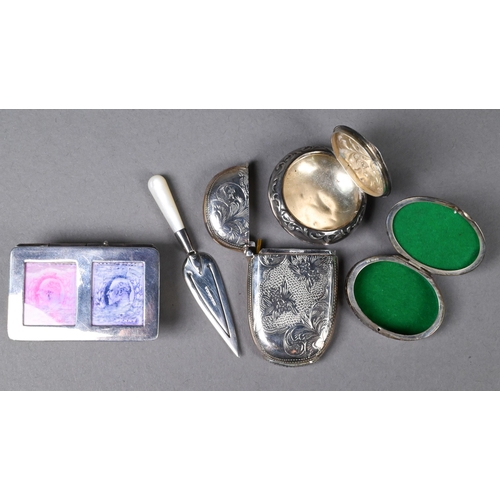 119 - A silver reproduction stamp-box, trowel bookmark, vesta case and pill box, to/w a Continental .830 g... 