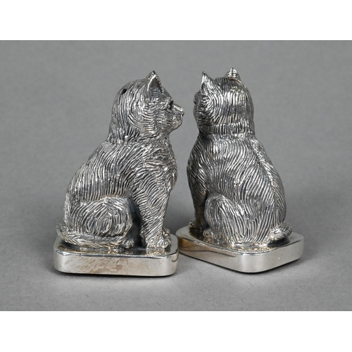 126 - A 925 standard 'Sterling' novelty salt and pepper pair, cast as seated cats with green glass eyes, 5... 