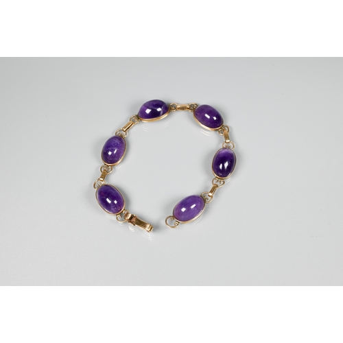 150 - An amethyst bracelet, the six oval cabochon stones with scroll links between, snap clasp, 18 cm long... 