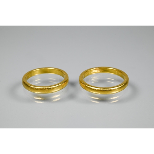 159 - Two unmarked and untested yellow metal wedding bands, approx 9.7g (2)