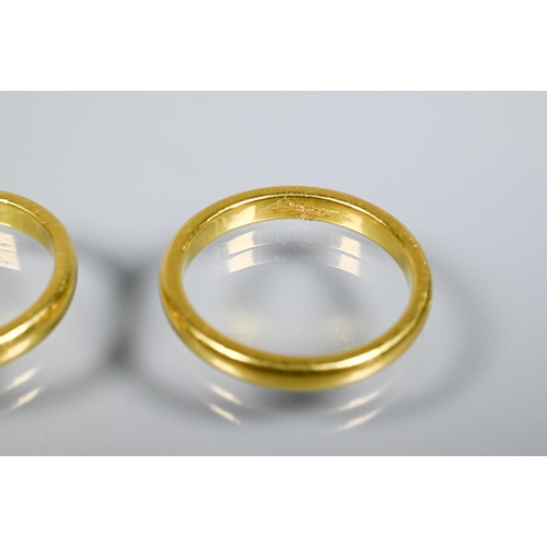 159 - Two unmarked and untested yellow metal wedding bands, approx 9.7g (2)