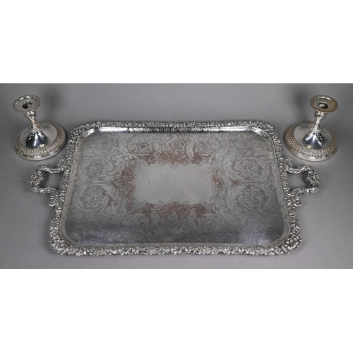 16 - Large epns tray with floral-cast rim and twin handles, to/w a pair of ep candlesticks on broad bases... 