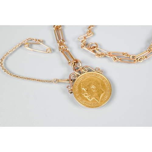 161 - A George V 1911 half sovereign in scroll mount, suspended from 9ct fetter-link chain