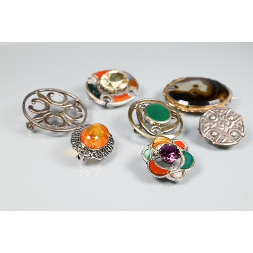 178 - A selection of Scottish/Celtic brooches including oval mixed agate with central 3.5 cm oval faceted ... 