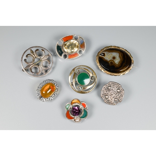 178 - A selection of Scottish/Celtic brooches including oval mixed agate with central 3.5 cm oval faceted ... 