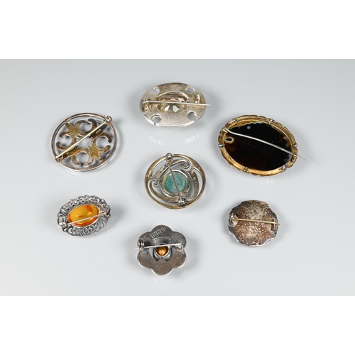 178 - A selection of Scottish/Celtic brooches including oval mixed agate with central 3.5 cm oval faceted ... 