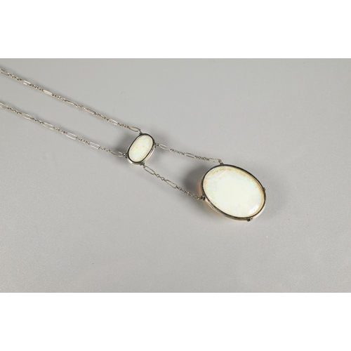 188 - An Edwardian necklace of fine white metal figaro chain set with pale oval opals