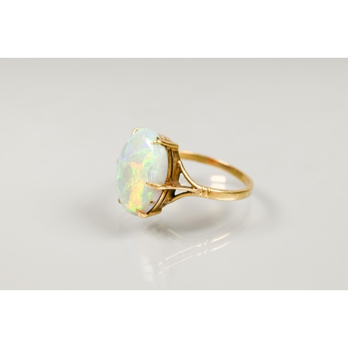 190 - An oval opal ring set yellow metal stamped 18ct, size P