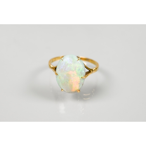 190 - An oval opal ring set yellow metal stamped 18ct, size P