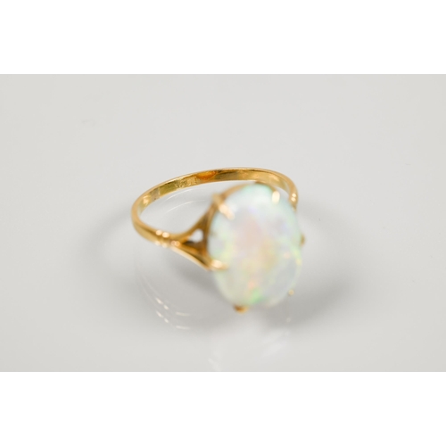 190 - An oval opal ring set yellow metal stamped 18ct, size P