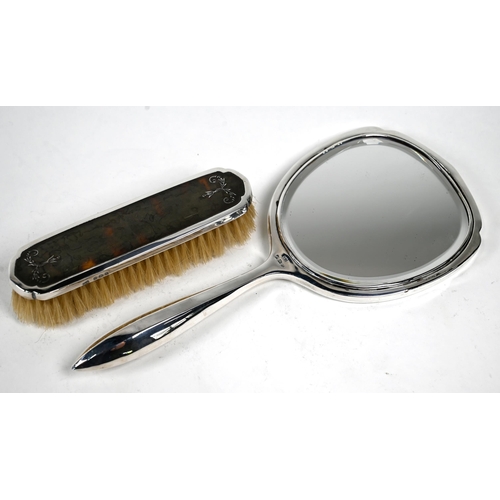 20 - A silver and tortoiseshell piqué brush set including hand-mirror, William Adams, Birmingham 1936/37