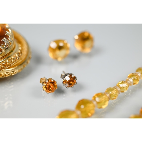 207 - A collection of topaz and citrine items including two faceted bead necklaces, earrings, brooch etc