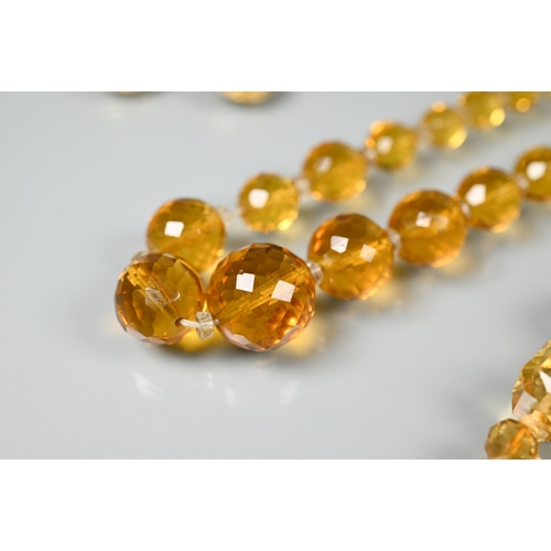 207 - A collection of topaz and citrine items including two faceted bead necklaces, earrings, brooch etc