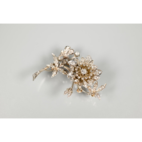 209 - A 19th century Continental diamond-set brooch en trembleuse, in three parts, in the form of an open ... 