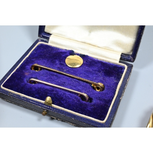 210 - Ten various 9ct gold stick/safety pins, some stone set, and cased set of safety pins and stud, appro... 