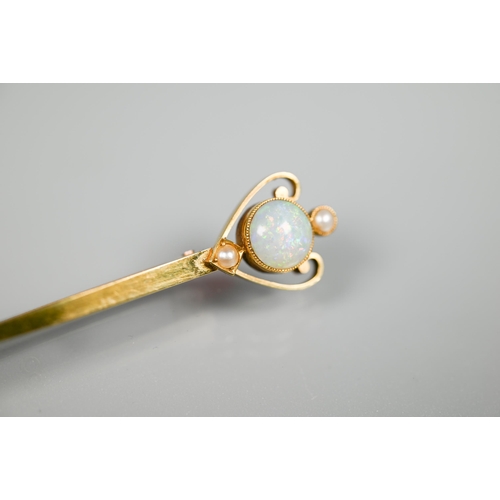 212 - A 15ct gold sword brooch set with opal and two pearls, 7.5 cm, 2.7g all in