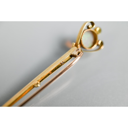 212 - A 15ct gold sword brooch set with opal and two pearls, 7.5 cm, 2.7g all in