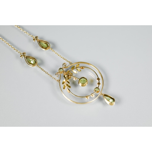 216 - An Edwardian peridot and seed pearl necklace, formed of two concentric circles, one with leaves and ... 