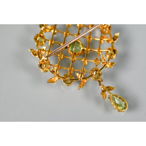 218 - An Edwardian demantoid garnet and seed pearl brooch, the open trelliswork design with seed pearl poi... 