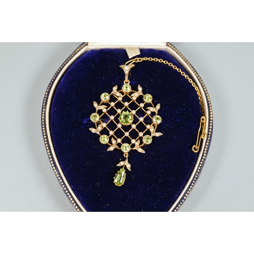 218 - An Edwardian demantoid garnet and seed pearl brooch, the open trelliswork design with seed pearl poi... 