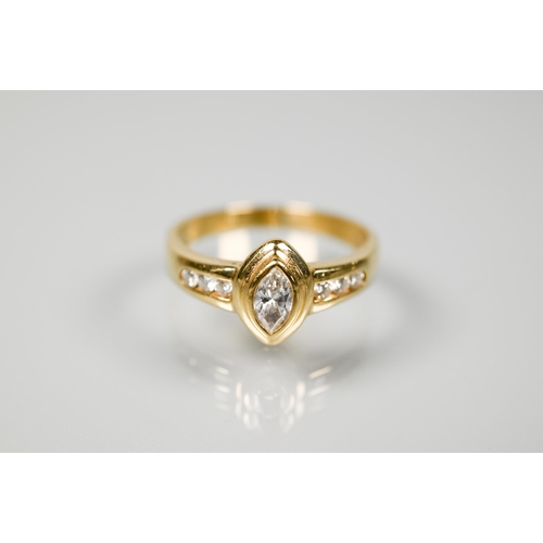 234 - A contemporary style ring with elliptical collet set diamond to the centre, with three graduated dia... 