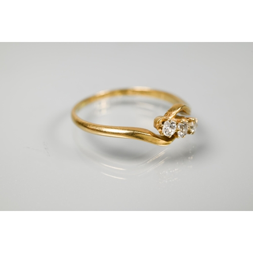 239 - A three-stone diamond ring in crossover setting, 18 ct yellow gold, size R 1/2, to/w an old narrow 2... 