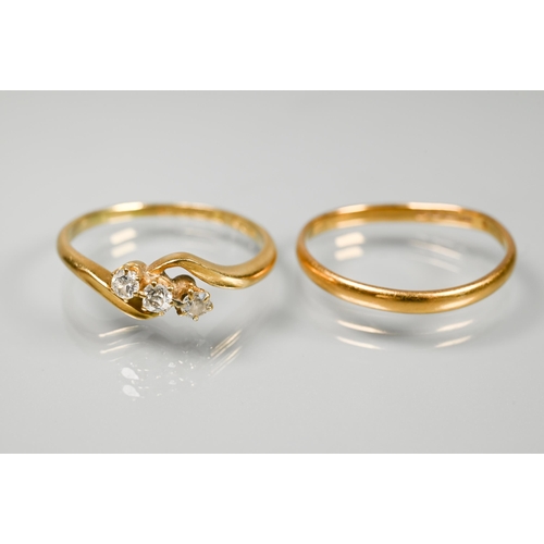 239 - A three-stone diamond ring in crossover setting, 18 ct yellow gold, size R 1/2, to/w an old narrow 2... 