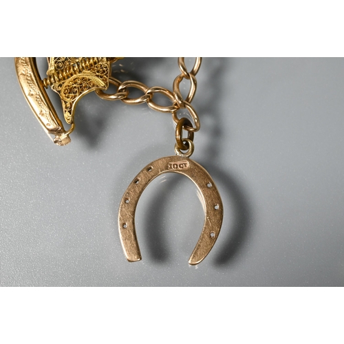 241 - A yellow metal curb bracelet with 10ct horseshoe, Portuguese cockerel, and dinghy attached, 11.5g al... 