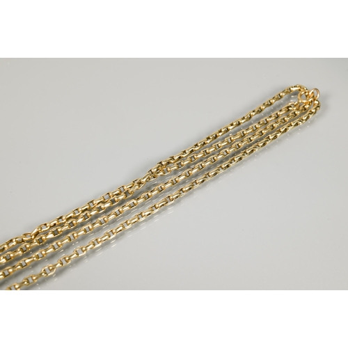 249 - A long yellow metal guard chain, 60 cm, unmarked, 21.2g