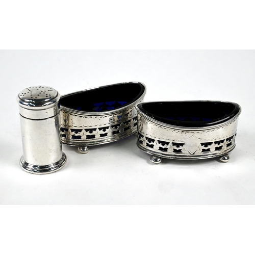 25 - A pair of late Victorian elliptical silver open salts with pierced sides and blue glass liners, on b... 