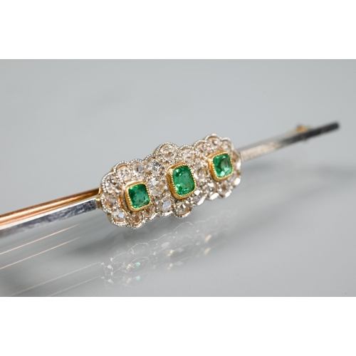 255 - A diamond and emerald cluster bar brooch formed of three conjoined circular clusters, milgrain set, ... 