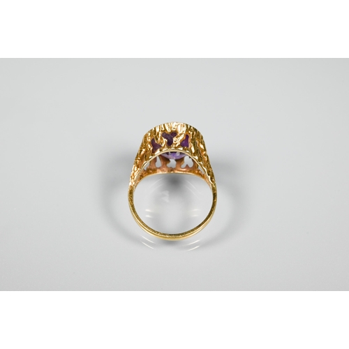 260 - A single stone ring set with oval Alexandrite (possiby), yellow metal stamped 14k