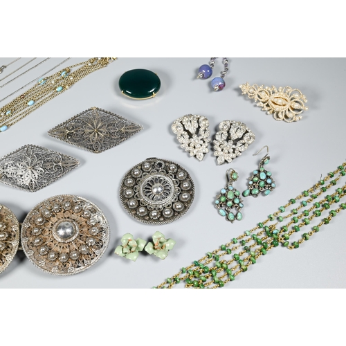 266 - Mixed jewellery items including Indian buckles, white metal filigree brooches, dress clips, seed pea... 