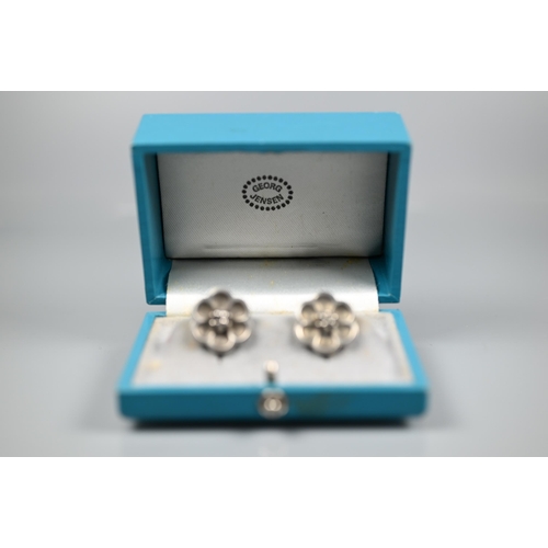 267 - Georg Jensen - A pair of white metal flower earrings, with screw fittings, stamped 67, in fitted box