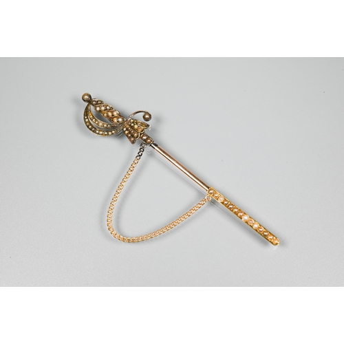 270 - A yellow metal dirk/shawl pin with seed pearl set pommel etc, 10 cm long