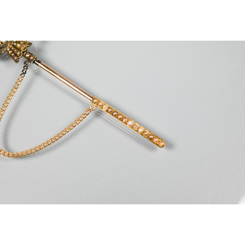 270 - A yellow metal dirk/shawl pin with seed pearl set pommel etc, 10 cm long