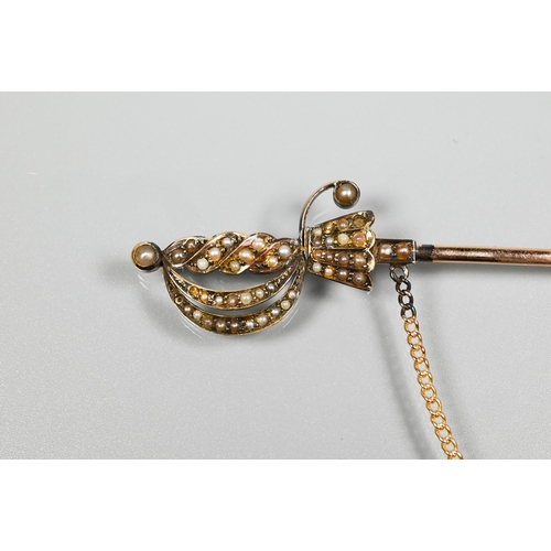 270 - A yellow metal dirk/shawl pin with seed pearl set pommel etc, 10 cm long