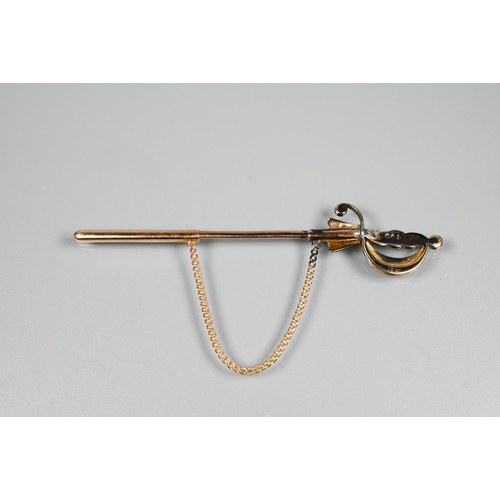 270 - A yellow metal dirk/shawl pin with seed pearl set pommel etc, 10 cm long