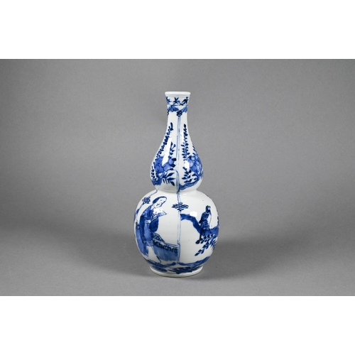 286 - A 19th century Chinese blue and white double gourd vase painted in underglaze blue with flowering br... 