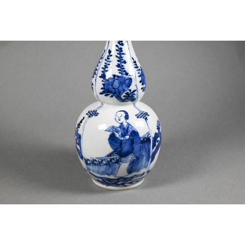 286 - A 19th century Chinese blue and white double gourd vase painted in underglaze blue with flowering br... 