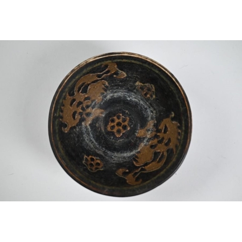 295 - A Chinese Southern Song style Jizhou ware bowl, the interior with paper-cut floral and abstract desi... 