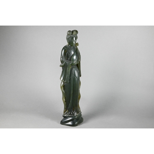 301 - A 20th century Chinese carved green soapstone figure of a courtesan wearing traditional robes with f... 