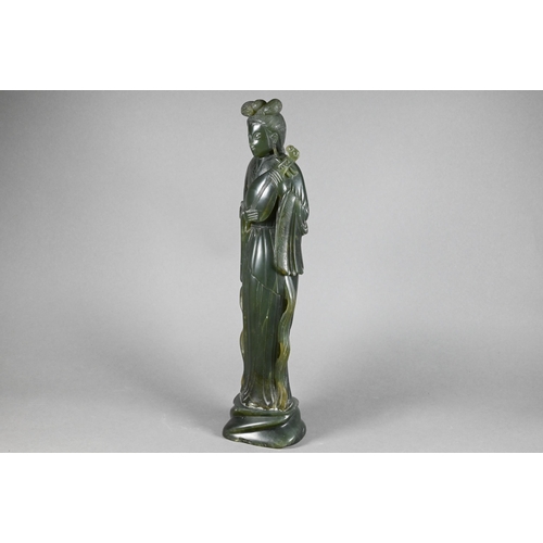 301 - A 20th century Chinese carved green soapstone figure of a courtesan wearing traditional robes with f... 