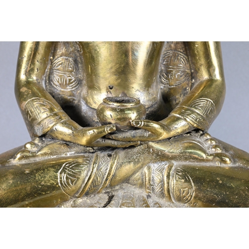 308 - A 20th century Thai polished bronze Amitabha Buddha holding an alms bowl, hands in dyana-mudra sitti... 