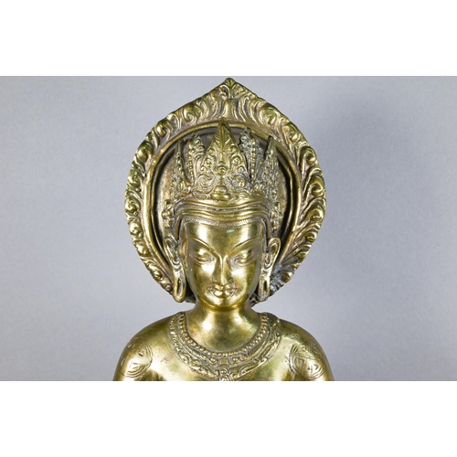 308 - A 20th century Thai polished bronze Amitabha Buddha holding an alms bowl, hands in dyana-mudra sitti... 