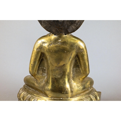 308 - A 20th century Thai polished bronze Amitabha Buddha holding an alms bowl, hands in dyana-mudra sitti... 