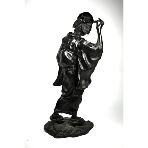 309 - A large late 19th century Japanese bronze okimono of a Geisha by Genryusai Seiya, cast wearing a kim... 